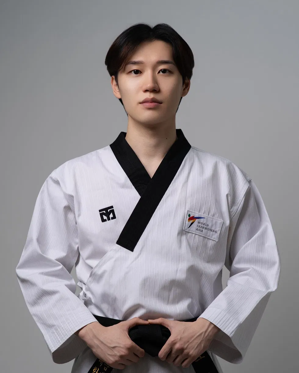 Master Cho Eun Sang, head instructor at Hyun Mu Taekwondo, in a black-belt dobok.
